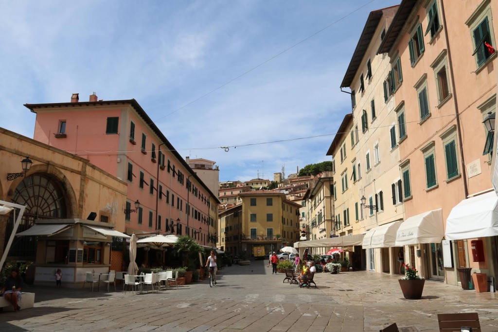 The large open piazza with many cafes and bars