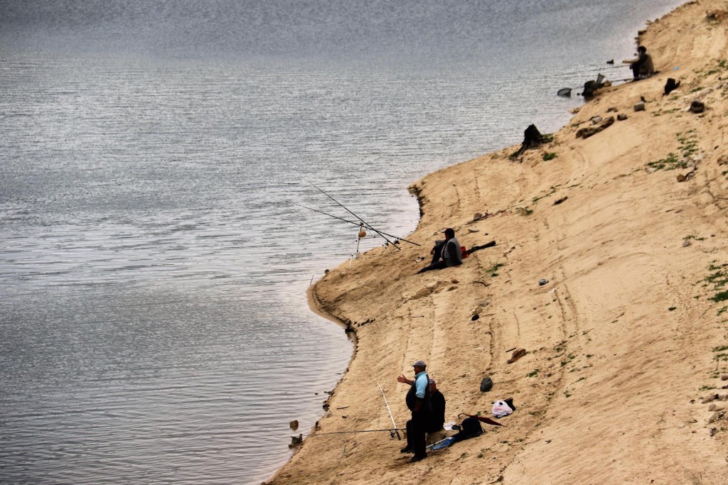 Fishermen at the Lago Govossai dam in the mountains south west of Orgosolo