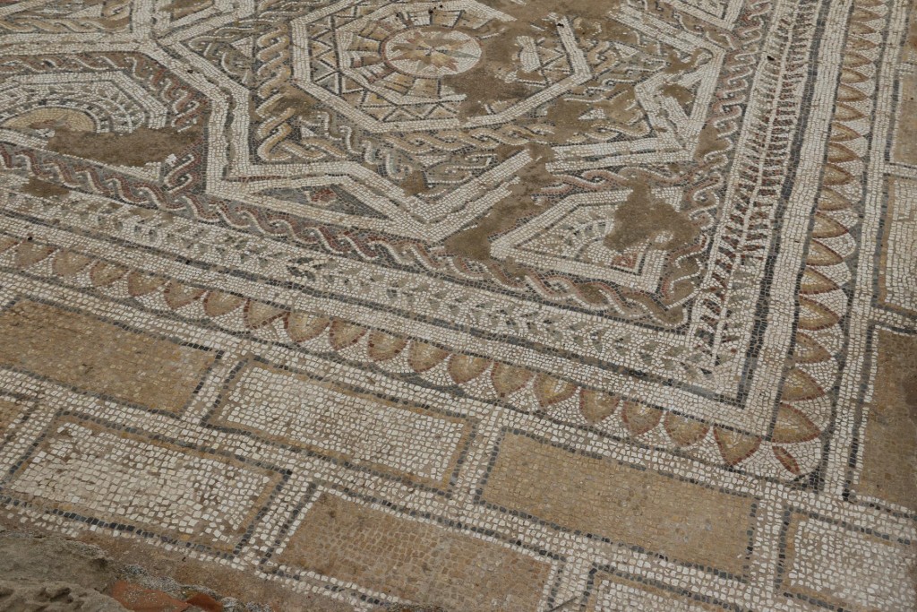 Floor mosaics can still be seen from the surrounding rooms of the villa