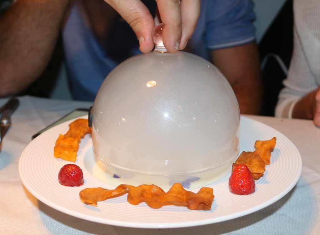 John and Angela order an unusual entree presented under a glass dome filled with dry ice 