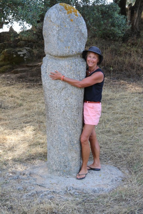 0Q1A7635 Michele hugs one of the ancient statues under the old tree (Copy)
