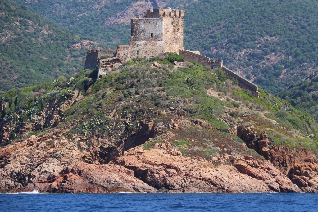 A conspicuous Genoese fort stands high on the small cape 