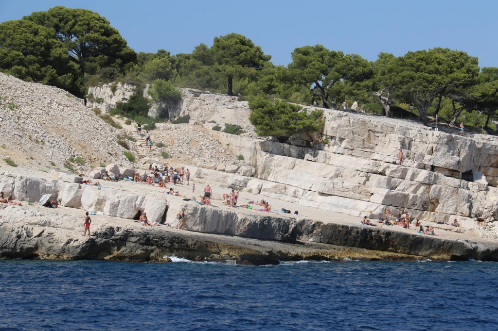  At the entrance to the  easternmost calanque called Port Miou, bathers make the most of the incredibe limestone slabs